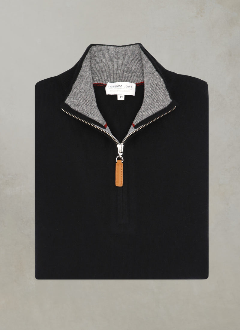 flat lay image of a solid quarter zip cashmere sweater in black with light grey contrasting inside of collar