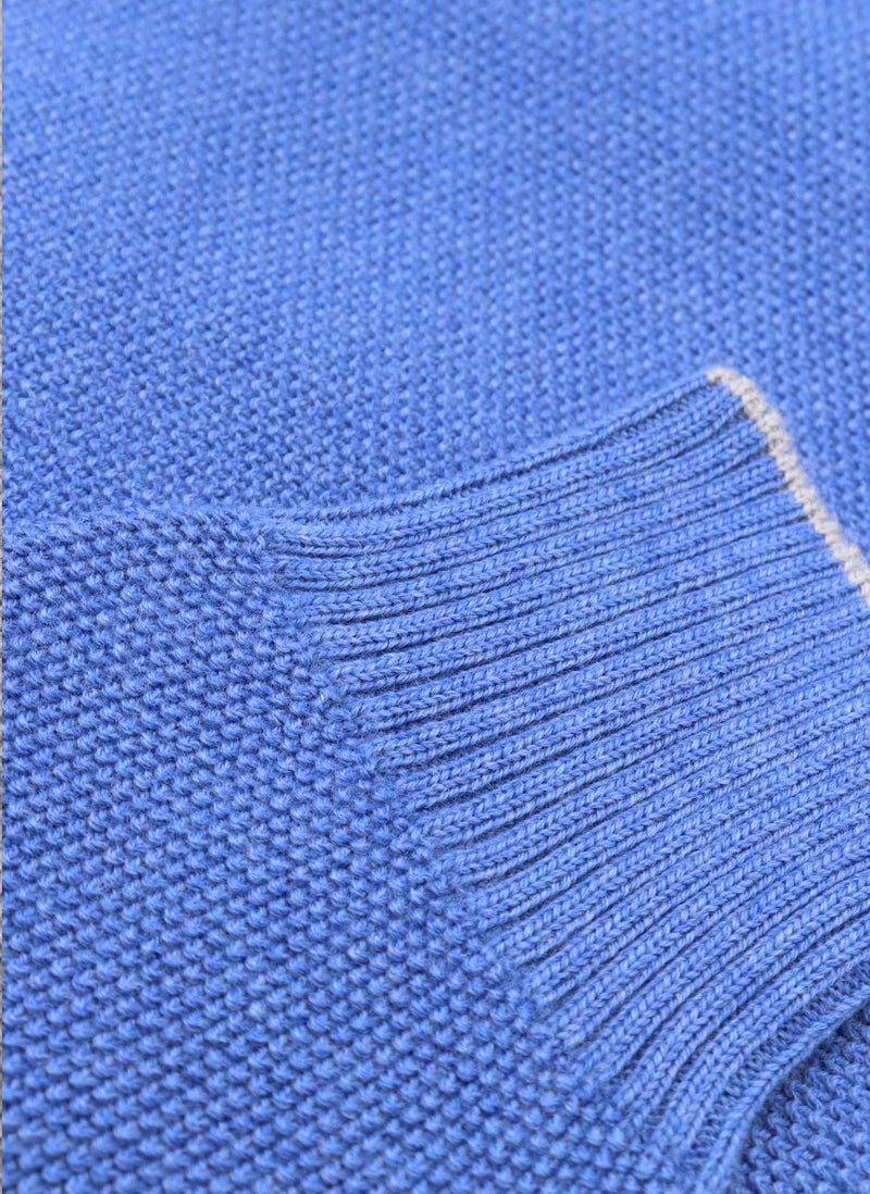 close up of ribbed cuff on a merino wool crew neck sweater in jeans mélange 