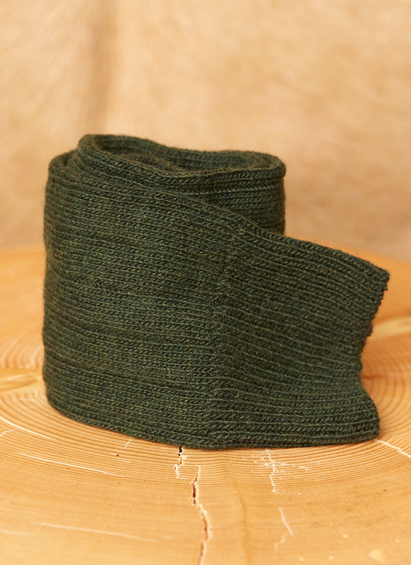 cashmere sock in forest green rolled