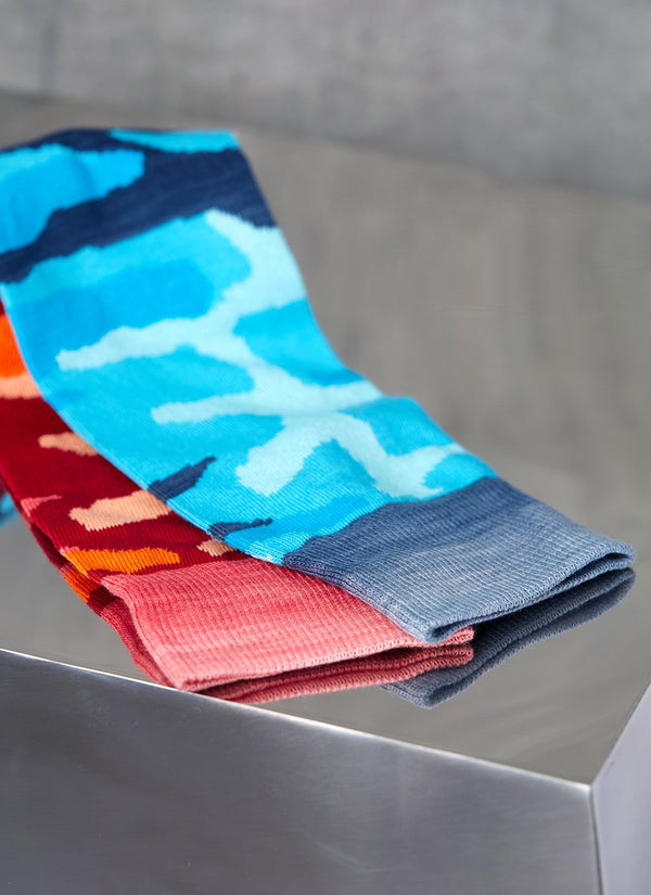 Grouping of Camo Sock in Teal and Camo Sock in Red
