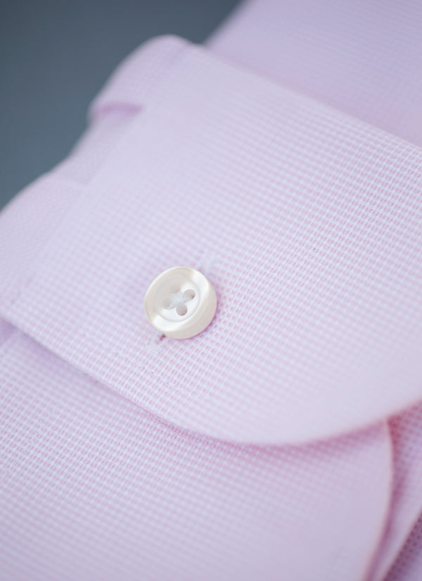 cuff of solid pink textured shirt