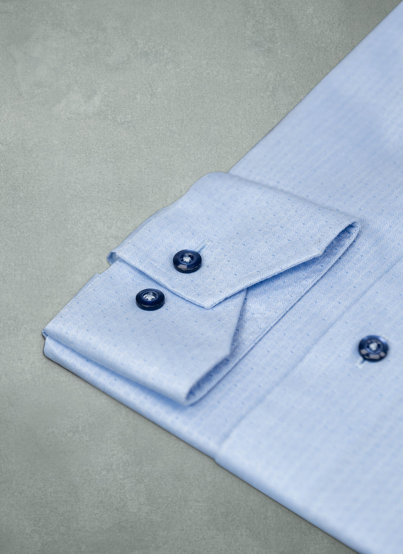 cuff detail of Alexander in Jacquard Waves Shirt with navy buttons