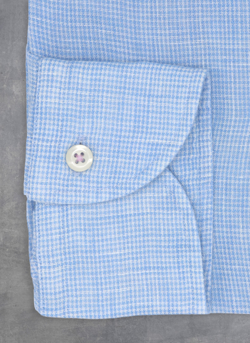 light blue gingham linen cuff with white buttons and purple thread