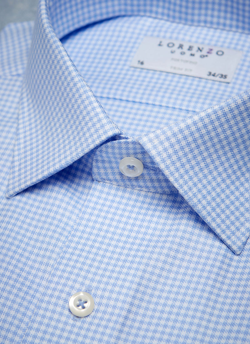 collar detail of blue gingham shirt with white buttons and light blue button threads