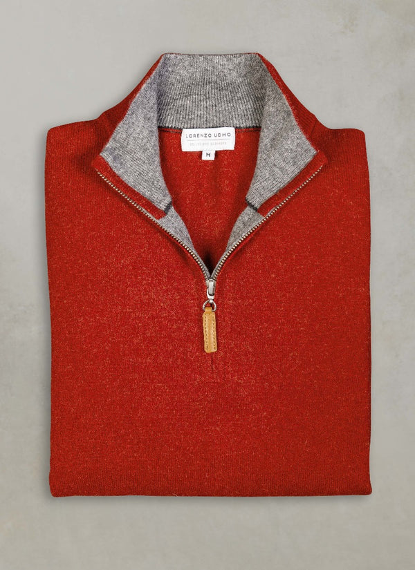 flat lay image of a solid quarter zip cashmere sweater in cinna with light grey contrasting inside of collar