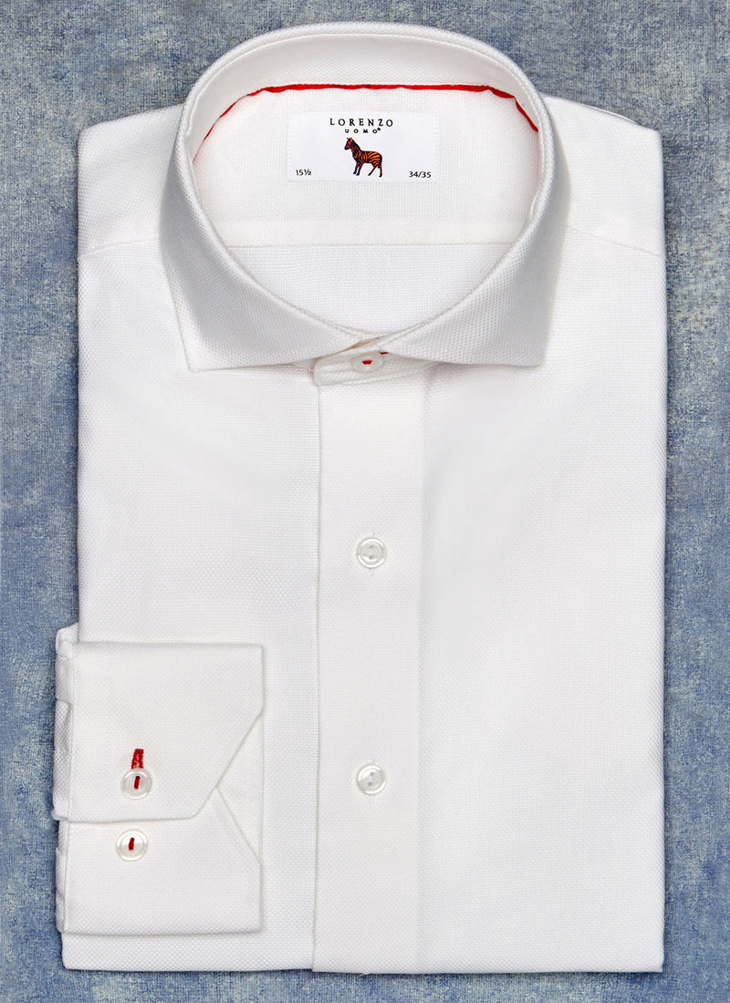 solid white shirt with red button hole and thread and red trim inside collar of the shirt