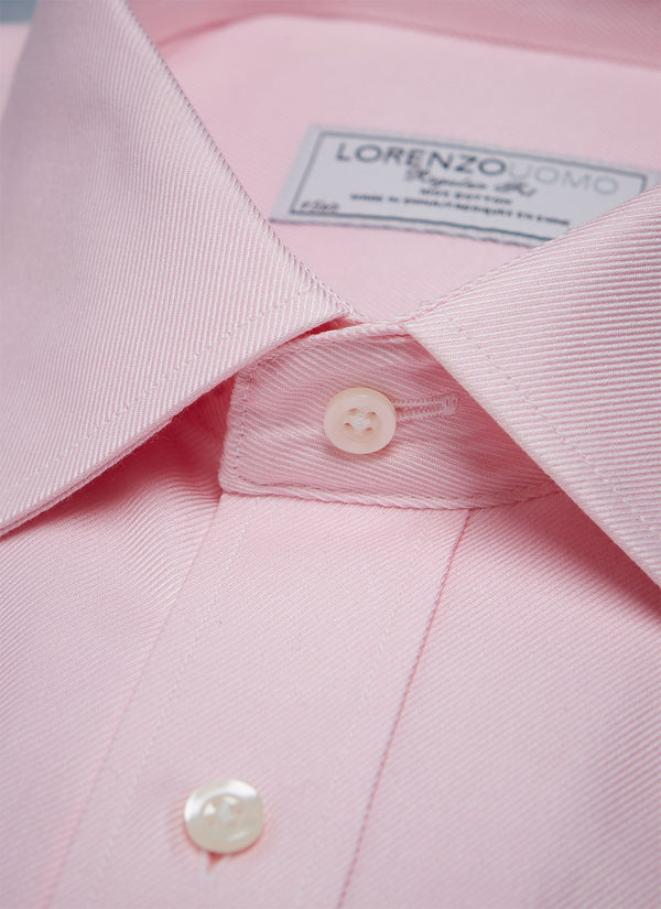 collar detail of solid pink twill dress shirt with white buttons and light pink button hole 