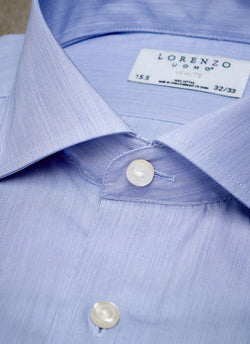 collar detail of blue micro stripe shirt with blue buttons 
