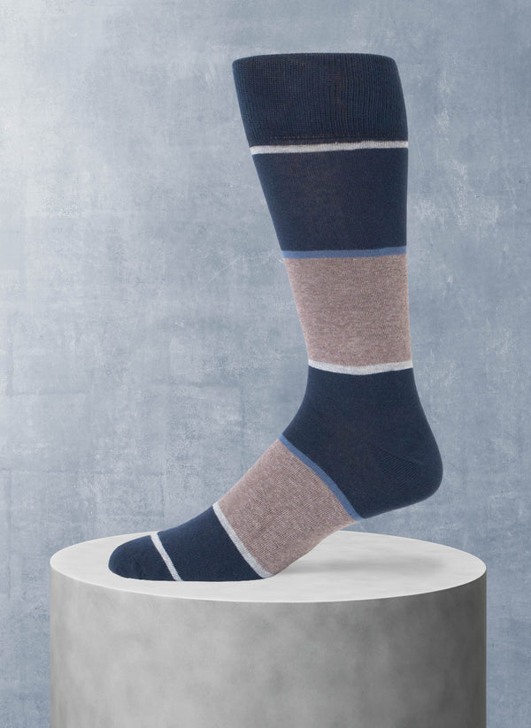 Color-blocked sock on a gray pedestal against a gray background