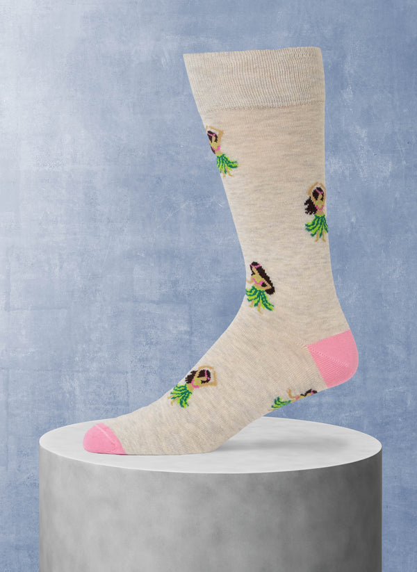 Beige sock with hula dancer design on a gray pedestal against a blue background