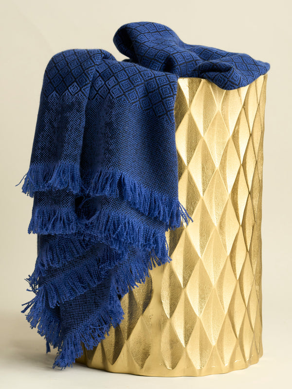 Cashmere Diamond Blanket with Fringe in Dusk placed in gold metal basket
