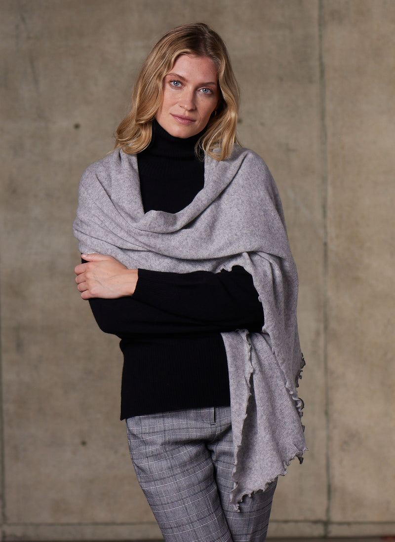 Women's Cinzia Turtle Neck Cashmere Sweater in Black featuring our cashmere light grey scarf 