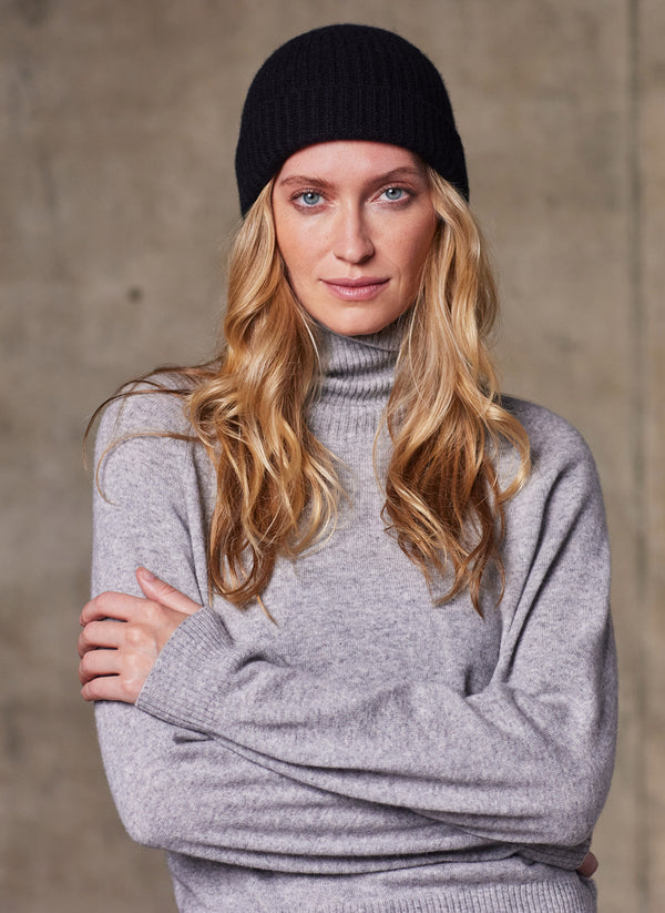 Women's Cinzia Turtle Neck Cashmere Sweater in Light Grey Featuring our Pure 100% Cashmere Unisex Rib Beanie in Black