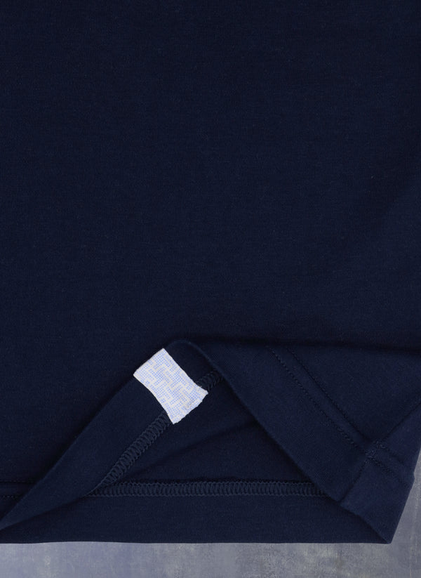 navy blue t-shirt with matching pajama bottom fabric tab on bottom of t-shirt