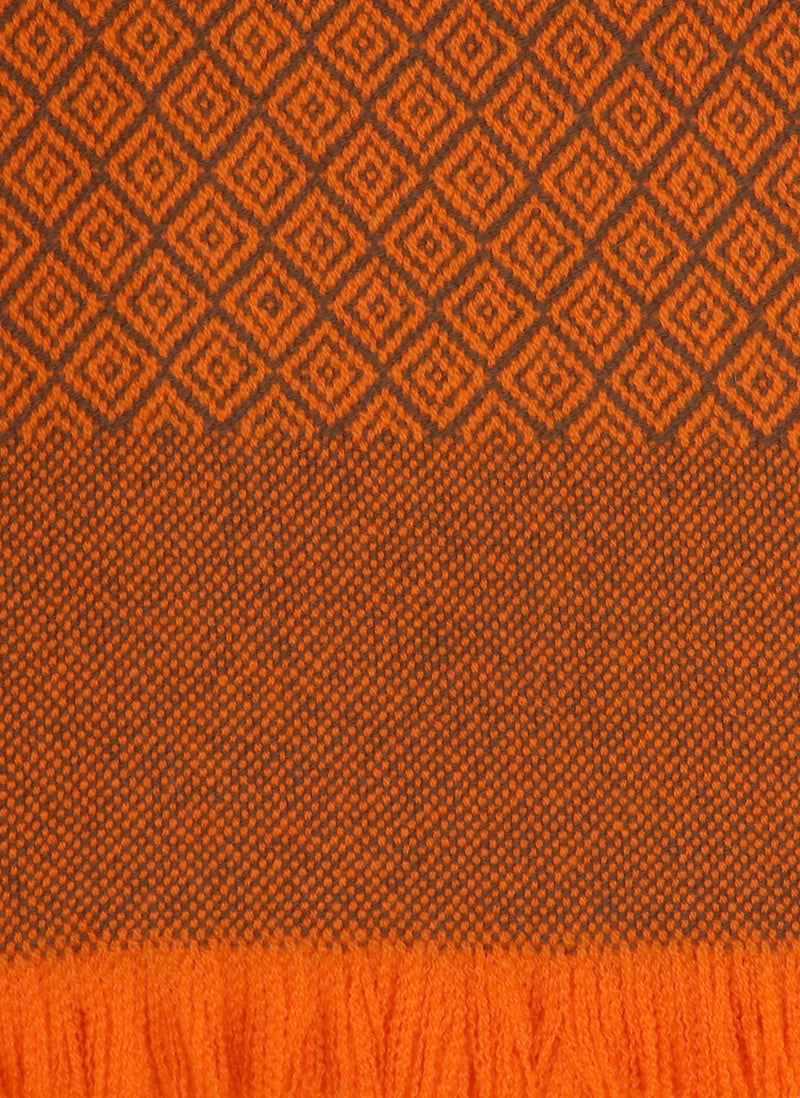 close up of Cashmere Diamond Blanket with Fringe in Retro Orange