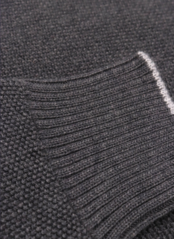 close up of ribbed cuff on a merino wool crew neck sweater in dark grey mélange