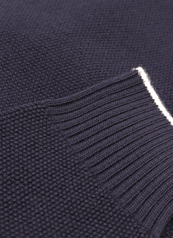 close up of ribbed cuff on a merino wool crew neck sweater in navy 