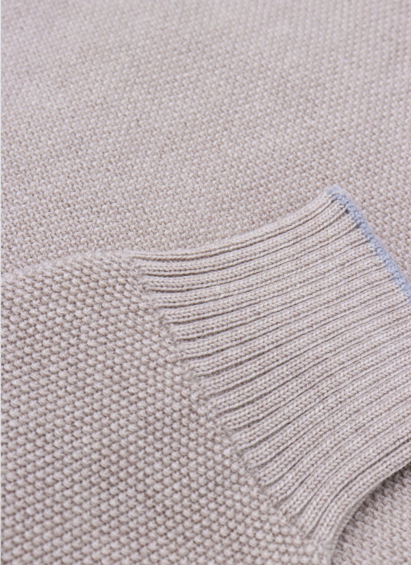 close up of ribbed cuff on a merino wool crew neck sweater in taupe mélange 