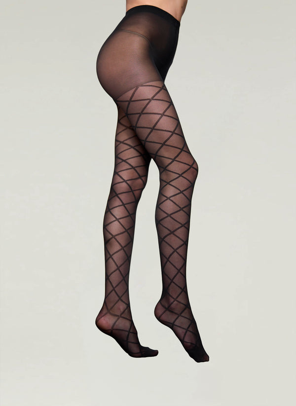 Black fishnet stockings on a plain background