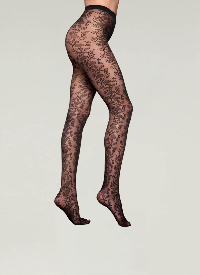 Black lace patterned stockings on a plain background