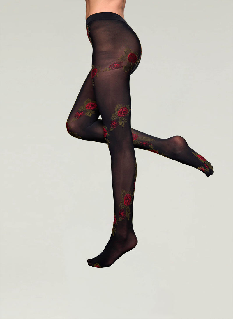 Black tights with floral patterns on a gray background