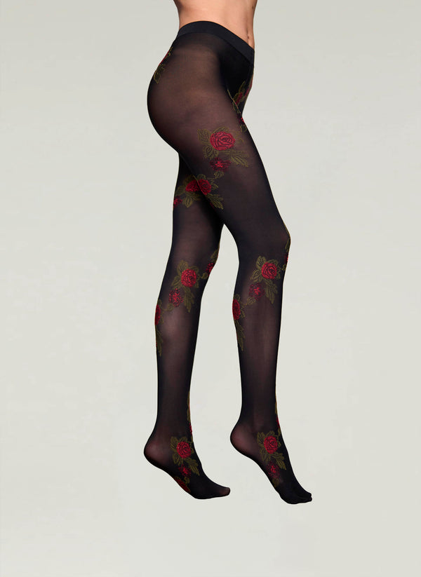 Black tights with floral embroidery on a neutral background