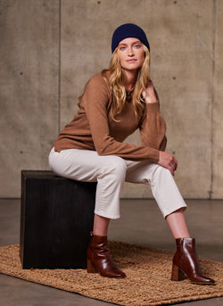 Women's Sofia Crew Neck Cashmere Sweater in Camel Featuring our Pure Cashmere Unisex Beanie in Navy