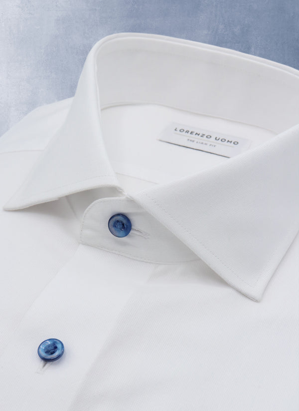 Collar detail of Liam in Solid White with Navy Mother of Pearl Shirt