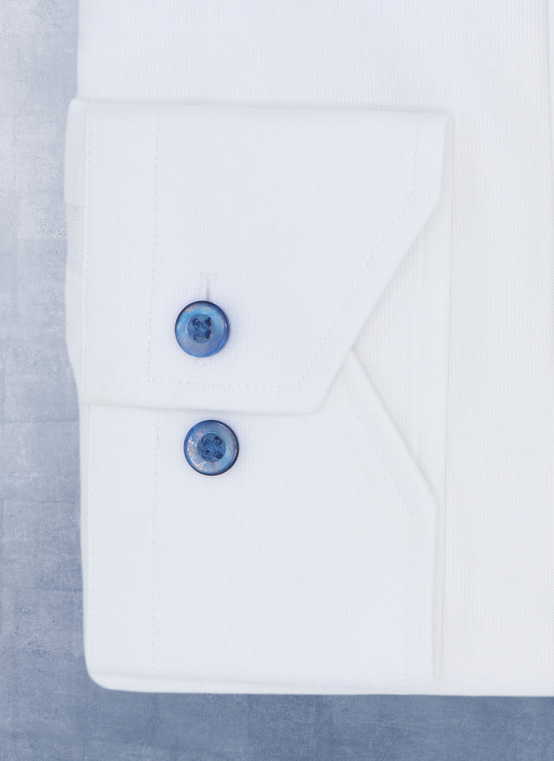 Cuff detail of Liam in Solid White with Navy Mother of Pearl Shirt