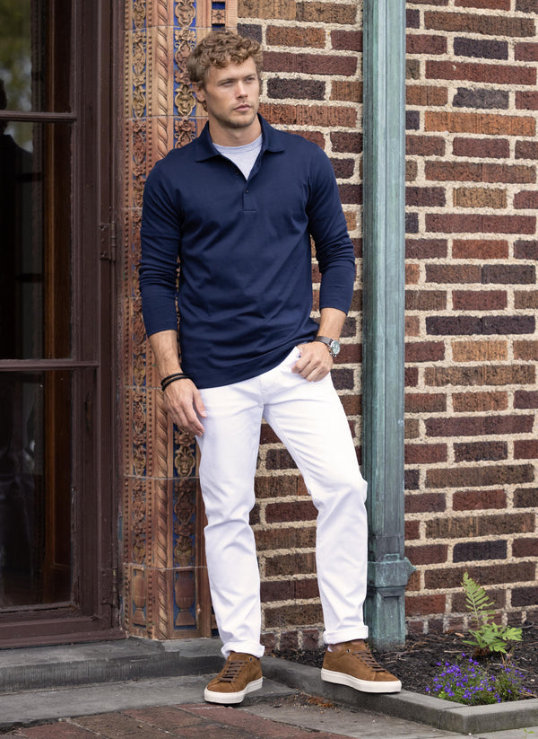 model wearing Supima® Cotton Long Sleeve Polo Shirt in Navy and a grey crew neck undershirt