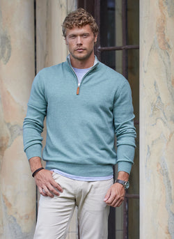 Model outside wearing Men's Madison Quarter Zip Cashmere Sweater in Seafoam with  a grey crew neck undershirt