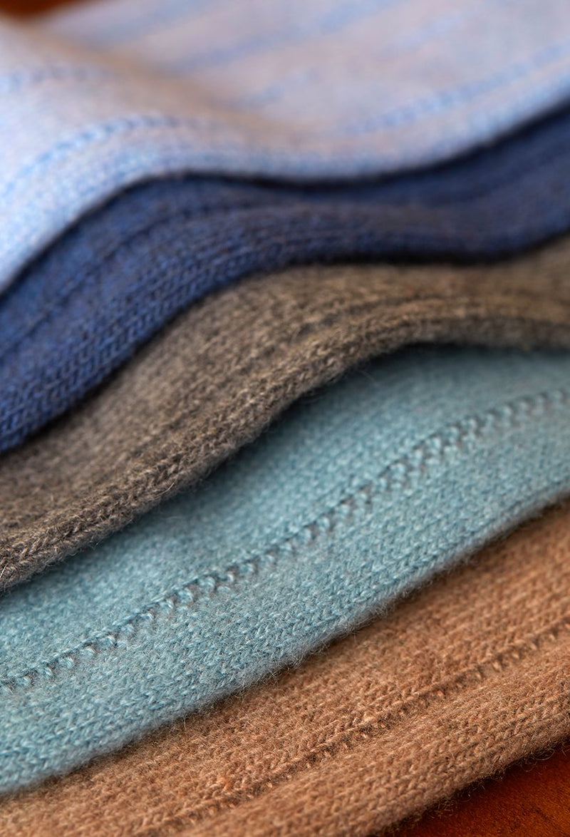 Group image of 75% cashmere socks in light blue, navy, brown, robins egg and taupe 