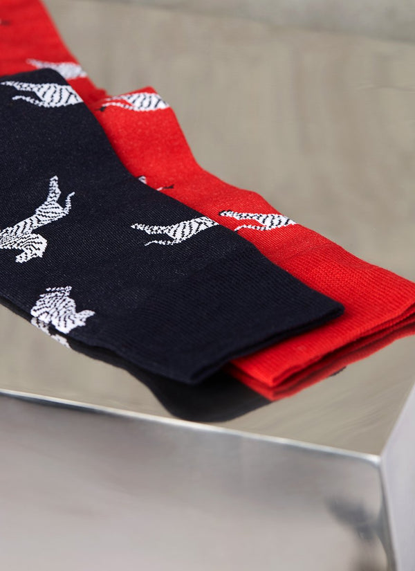 Group image of large zebra sock in red and another large zebra sock in navy