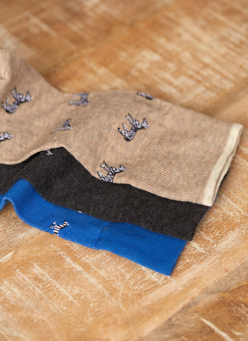 group image of three socks laying flat. one sock is a medium zebra sock in beige, another pair is a medium zebra sock in charcoal and a third sock in a medium zebra sock in royal blue