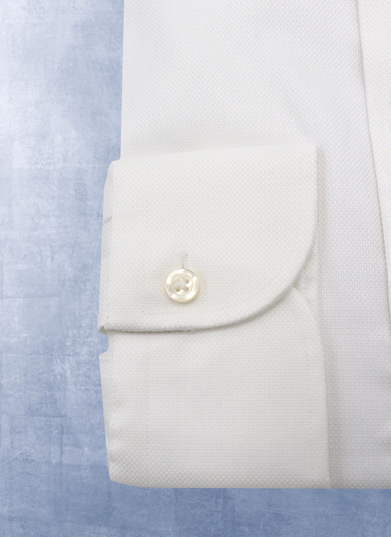 cuff of solid white textured shirt