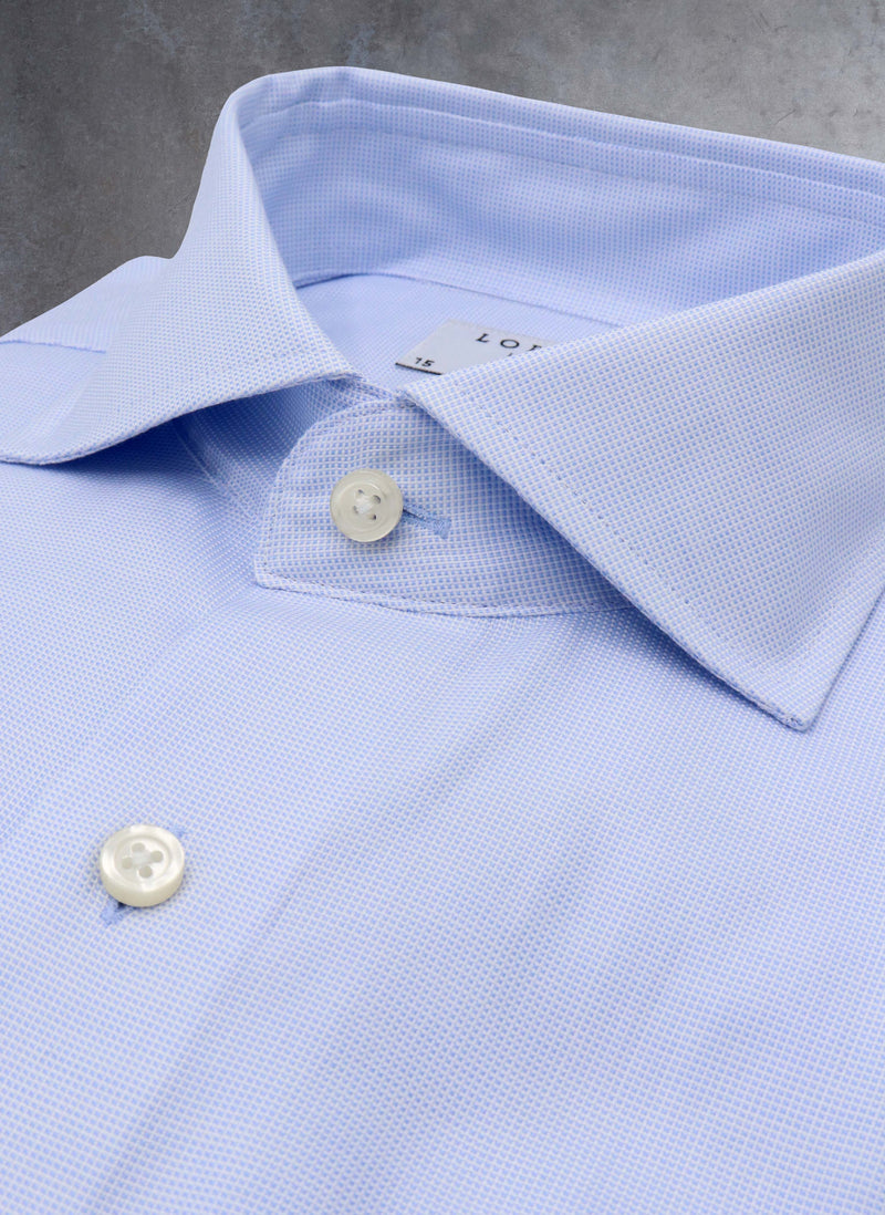 collar of light blue mini square shirt with white buttons