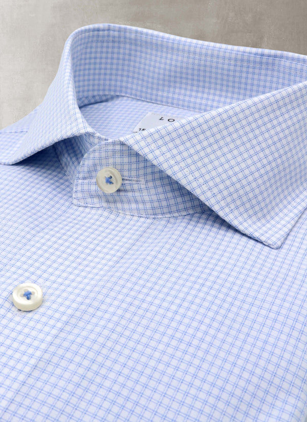 collar detail of blue double check shirt with white buttons and blue button threads