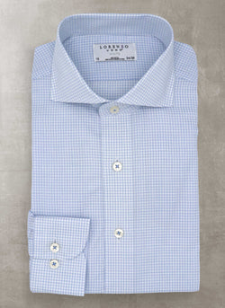 blue double check shirt with white buttons and blue button threads
