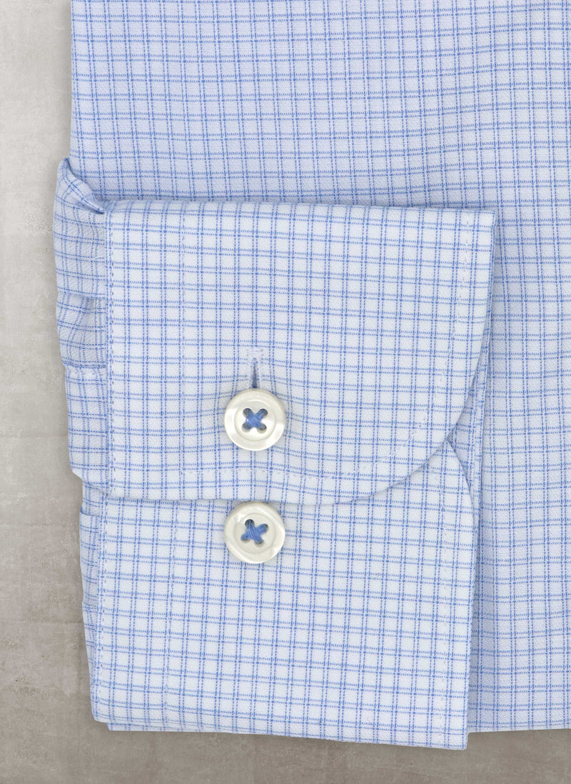 cuff detail of blue double check with white buttons and light button whole threads