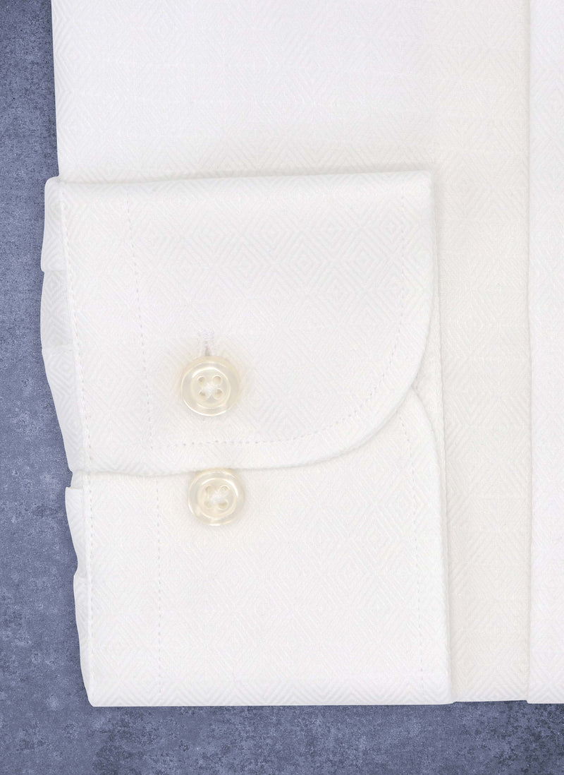 cuff detail of white diamond print textured shirt