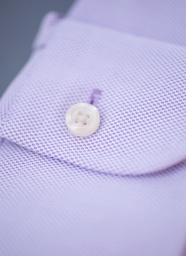 purple cuff detail with white button