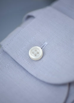 solid textured grey button detail with white buttons