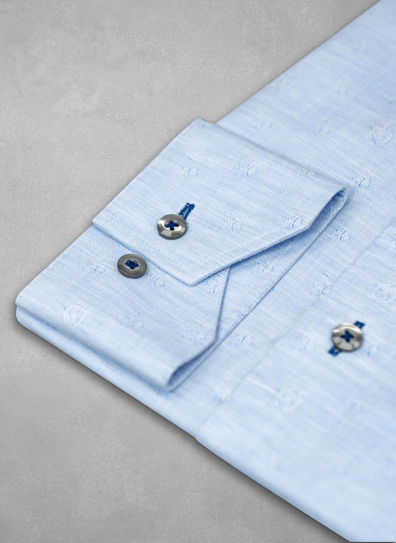 cuff detail of Alexander in "Mediterraneo" Jacquard Linen Shirt with navy button holes and grey buttons  - fish on shirt