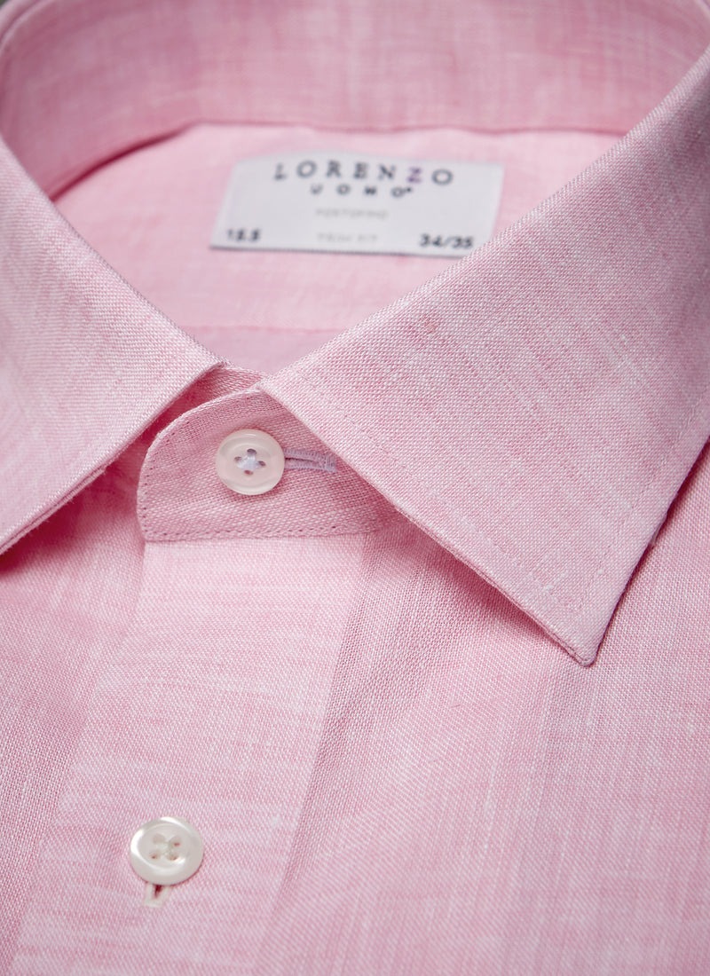 collar detail of pink linen shirt with light blue button holes and button threads with white buttons