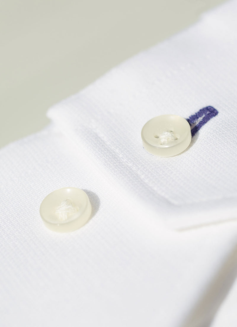 White Knit Shirt with navy contrast button hole cuff detail