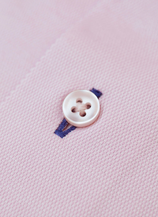 light pink button with navy blue button hole