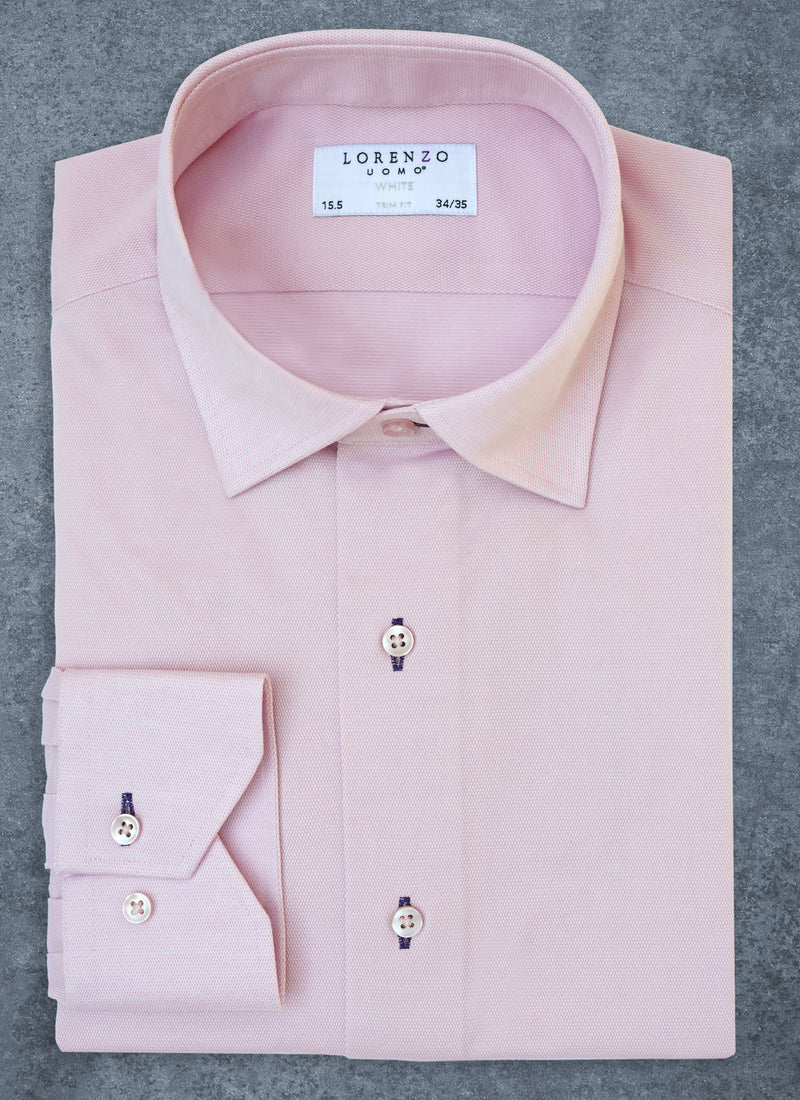 alexander in pink knit shirt with navy button holes