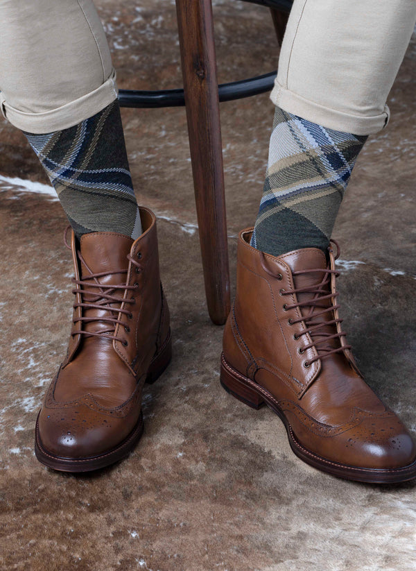 Merino Wool Plaid Sock in Olive on brown leather foots