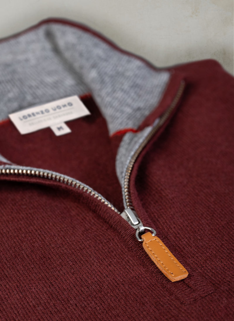 close up angle image of burgundy quarter zip cashmere sweater with ykk zipper