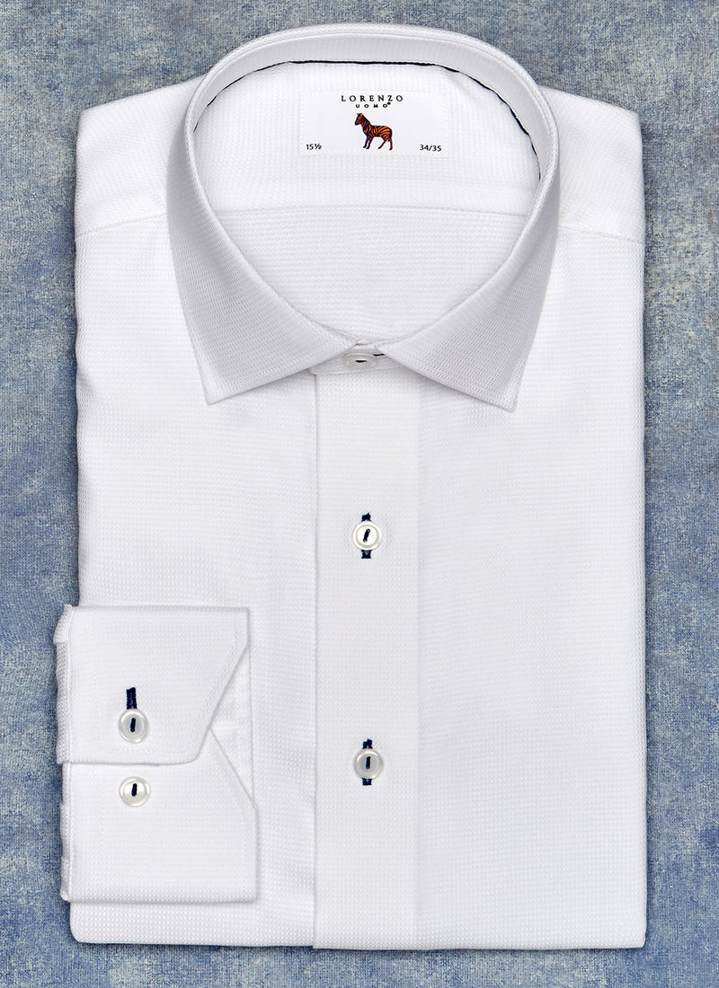 solid white shirt with blue contrast button hole and thread and inside blue trim detail